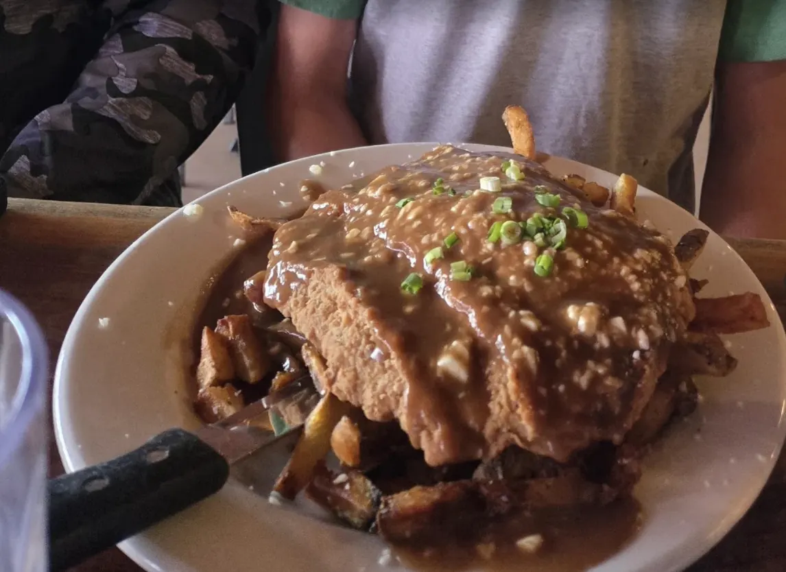 Breaded cutlet over hand-cut fries smothered in gravy at Killian's Spearfish restaurant
