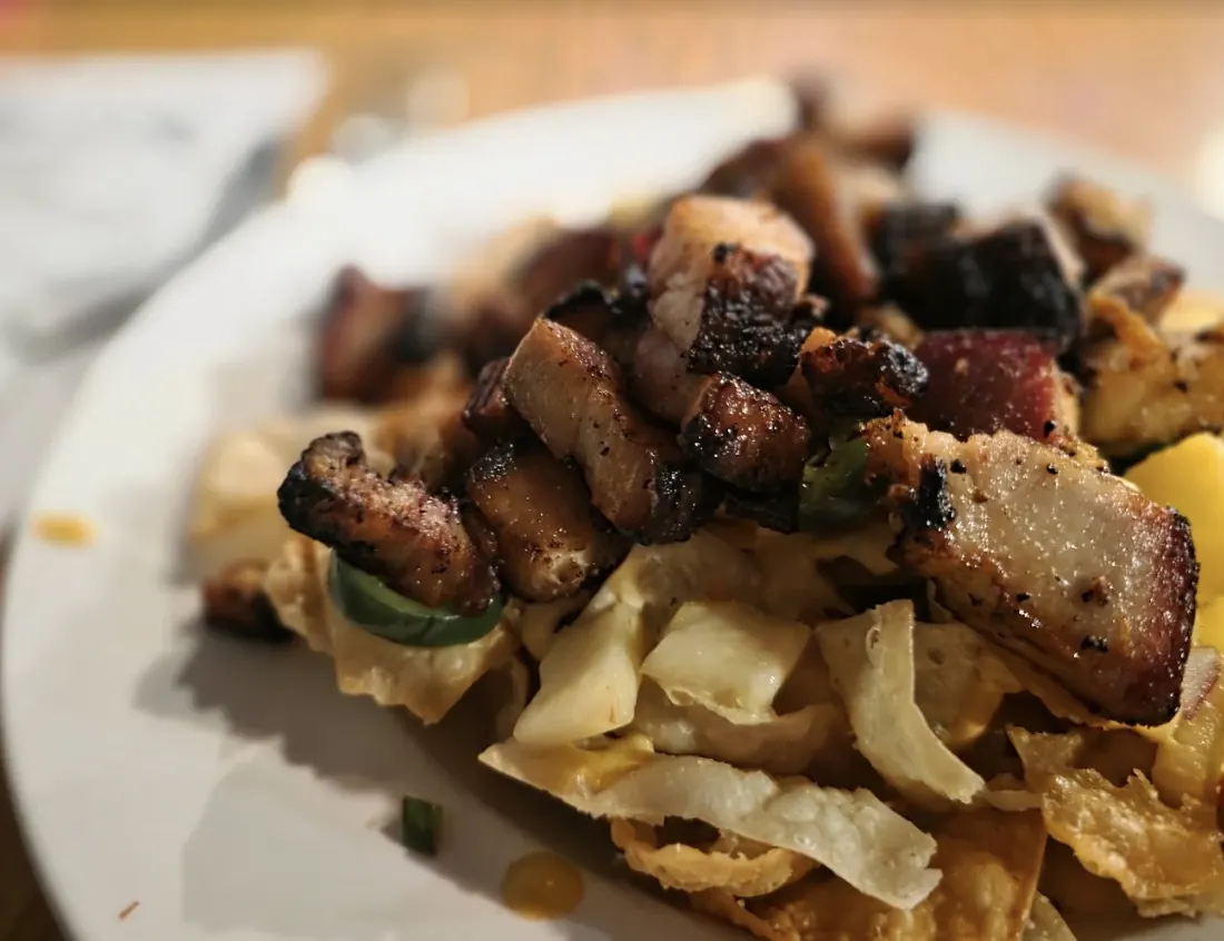 Crispy chips piled with charred pork belly and jalapeños at Killian's in Spearfish, Black Hills
