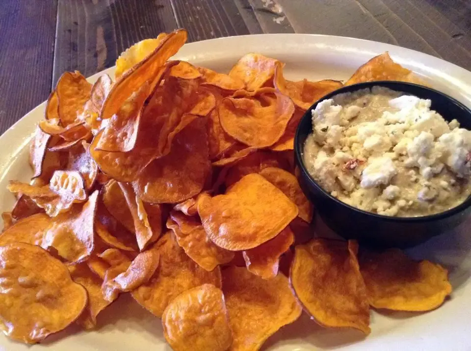 Killian's sweet potato chips happy hour appetizer House-made sweet potato chips topped with pulled meat and blue cheese at Killian's in Spearfish, SD